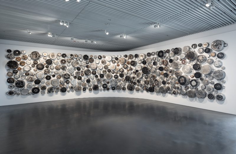 Maha Malluh, Food for Thought Al-Muallaqat 4, 2016, Aluminum pots, 400 x 1400 cm. Art Jameel Collection. Photo by Mohamed Somji